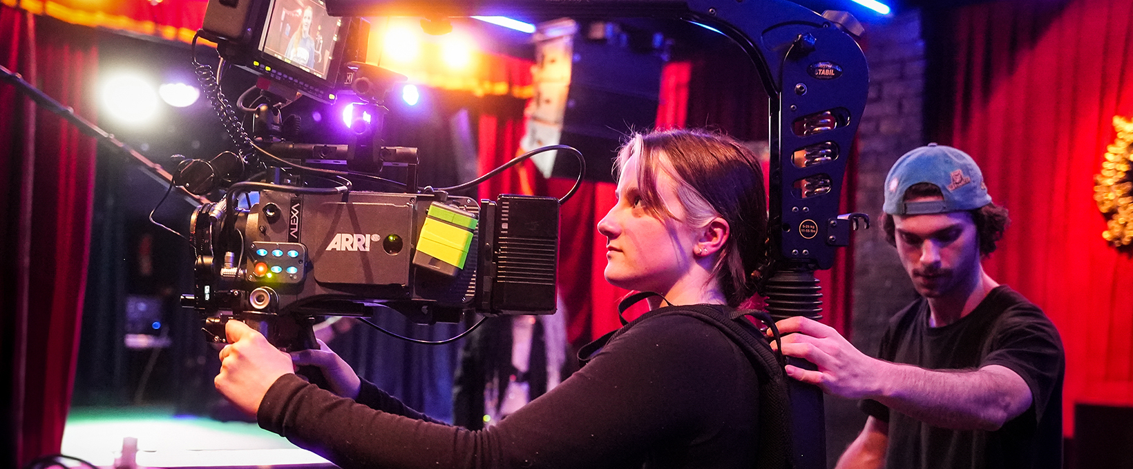 Camera operator and assistant setup for an interior shot
