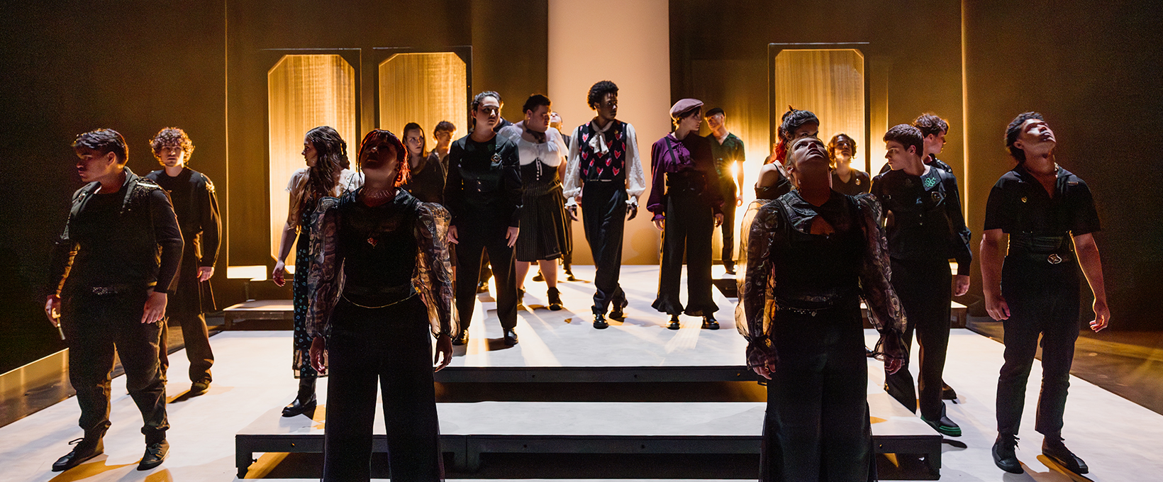 Group of acting student pose while during a stage production