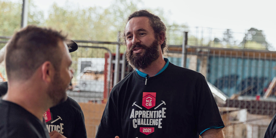 One of the judges Clēment talking to the contestant at the New Zealand  Certified Builders Auckland Apprenticeship challenge 2021.  