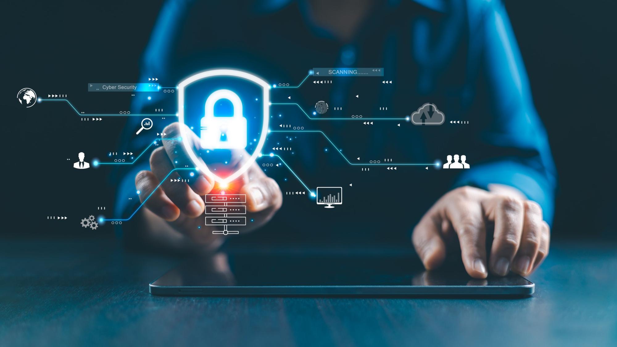 Person interacting with a futuristic cybersecurity interface on a tablet, displaying scanning data, digital lock icons, and global network symbols in a blue-toned tech theme.