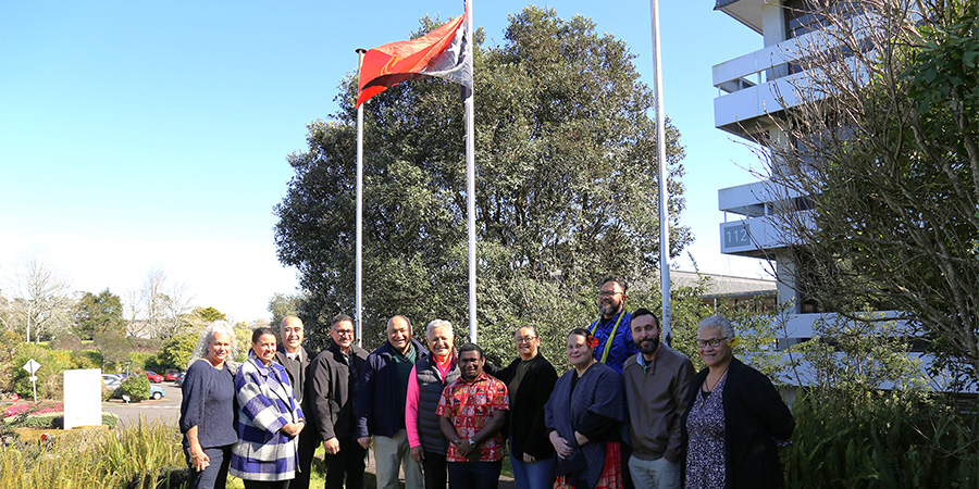 Members of the senior leadership team, joined by kaimahi from the Pacific Centre and MAIA Marae Team, along with Emmanuel Simon, at the flag raising ceremony