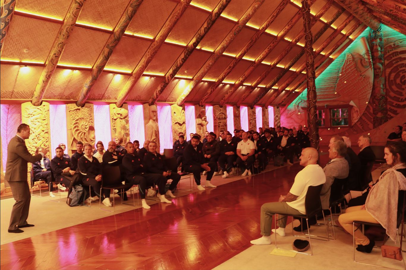 French rugby team during manuhiri whaikōrero as part of their pōwhiri at Te Noho Kotahitanga marae
