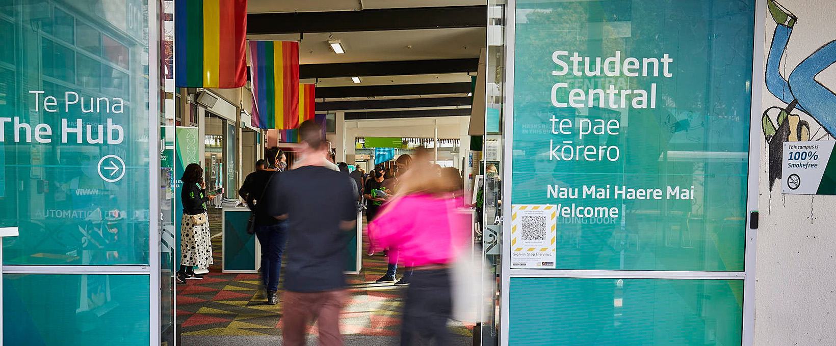 Rainbow pride flags hang from the ceiling of Te Puna at Mt Albert campus