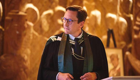 Peter McPherson presents at a lectern during his professorial address