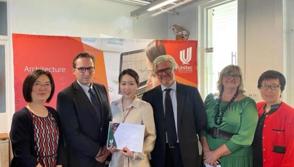 From left to right of the picture, Xinxin Wang, Peter McPherson, Qi yang, Matthew Bradbury, Sandra Potier and Grace Zhang, are looking at and smiling for the camera