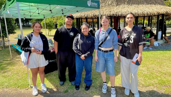  Pacific students standing in front of the Fale at Unitec's 2025 orientation