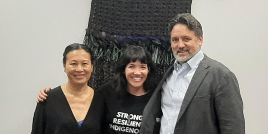 Dr Nālani Wilson-Hokowhitu smiles with her colleagues.