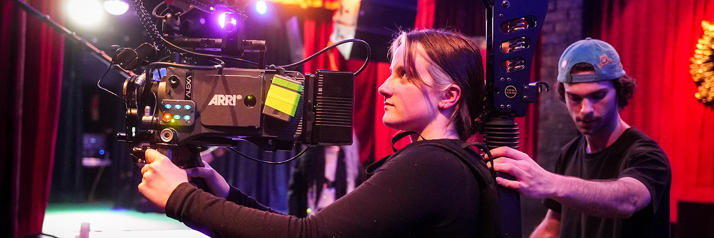 Camera operator and assistant setup for an interior shot