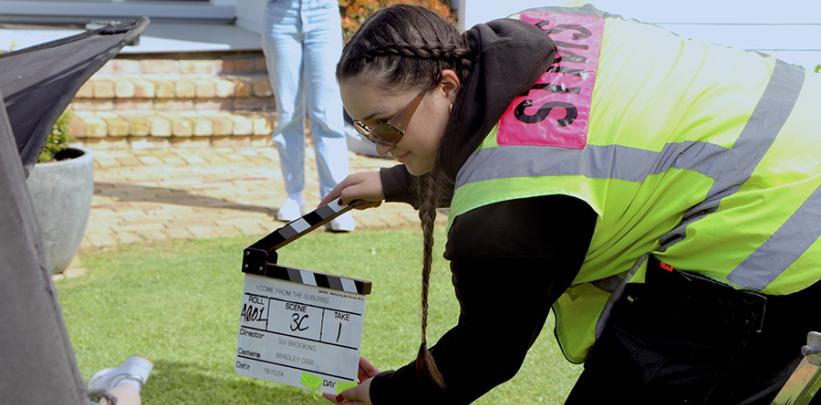 Hana Kurukaanga handles the callperboard during filming