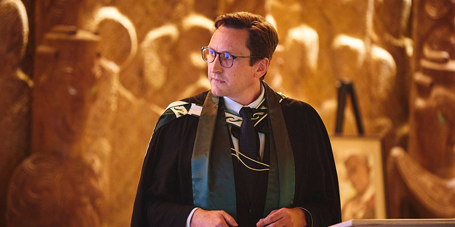 Peter McPherson presents at a lectern during his professorial address