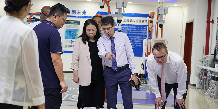 Unitec delegates explore a robotics lab at Hebei University of Engineering