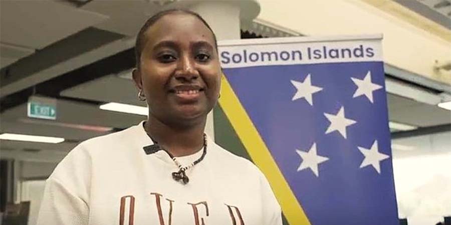 Bachelor of Business student Relmah Alopitu smiles at a display for Solomon Islands Language Week.