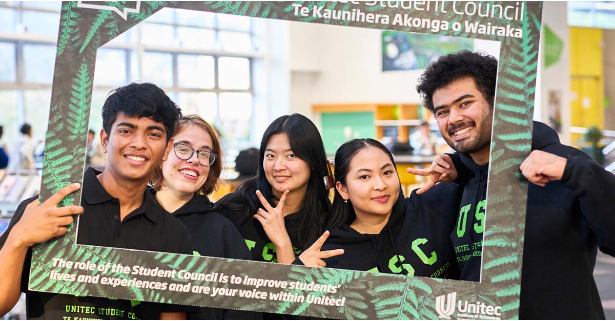 The Unitec student council smile and pose for the camera.