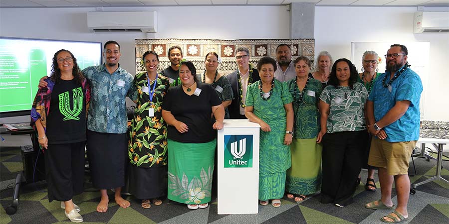 The speakers at MIT and Unitec's ITP Research Symposium 2025 smile for the camera.
