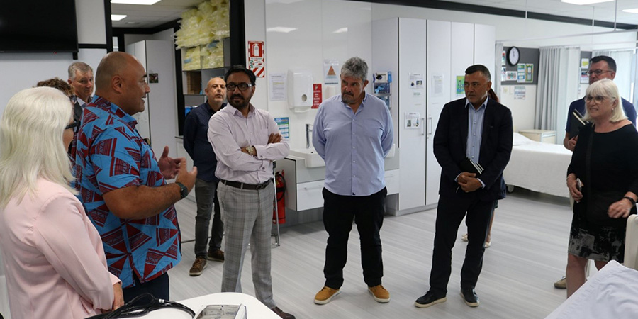 Peseta Sam and MIT Head of Nursing Assoc Prof Deb Rowe (left) show council the nursing training facility at Manukau Campus