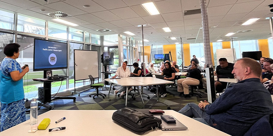 Attendees at the AI Agent event listen to a speaker.