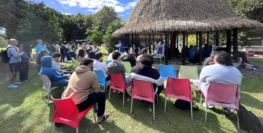 Staff and students gather around the Unitec fale during the opening ceremony of Pacific Day.