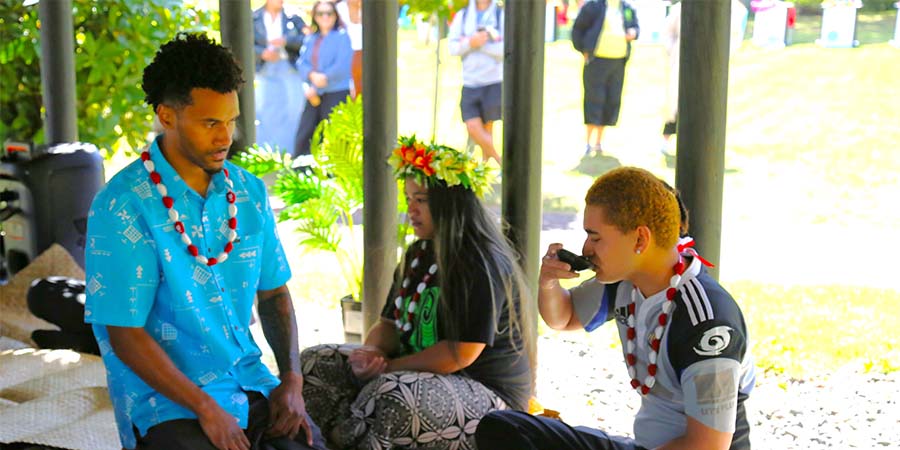 People sit in the Unitec fale participating in a kava ceremony.