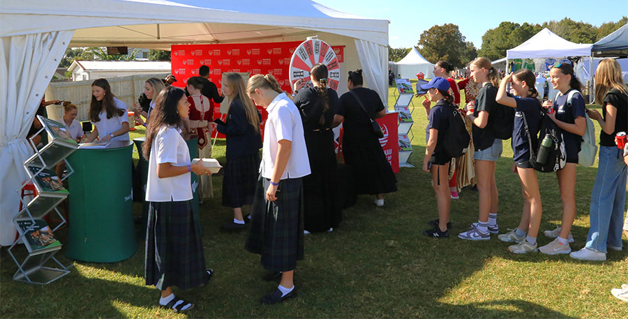 People explore the MIT and Unitec marquee. 