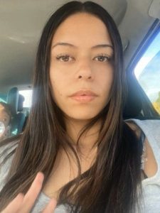 Nikiah Rodriguez takes a selfie inside a car.