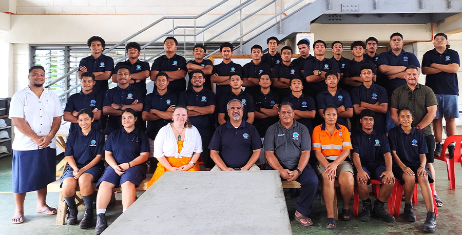 A carpentry class pose for the camera.
