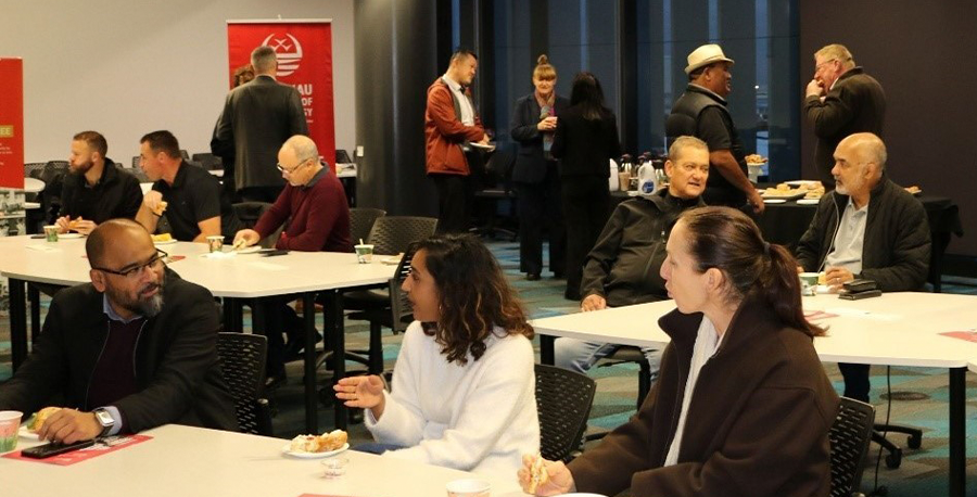 Attendees at the breakfast chat seated at a table.