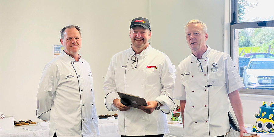 Judges and MIT Senior Lecturer Peter Rood, sponsor Murray Upton from Champion Flour and MIT Senior lecturer Ralf Schmidt smile for the camera. 