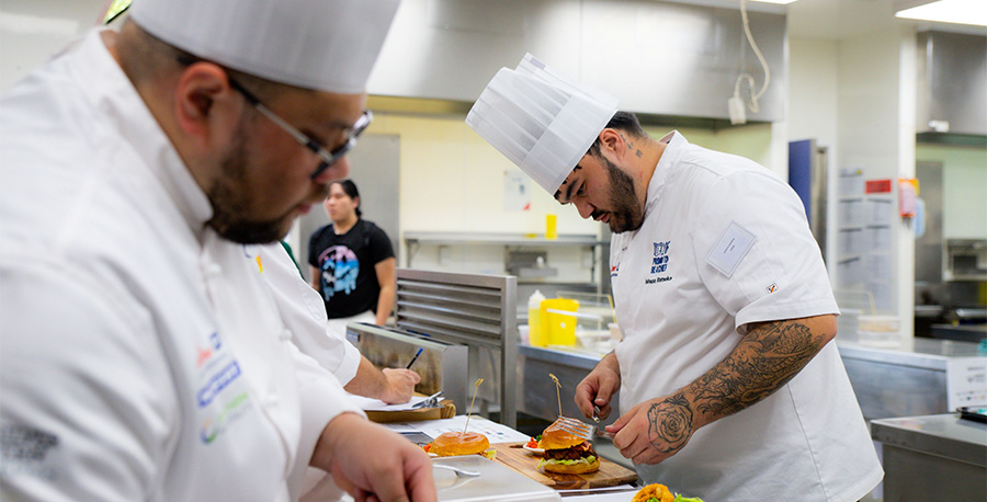 Student chefs hard at work cooking during the competition.