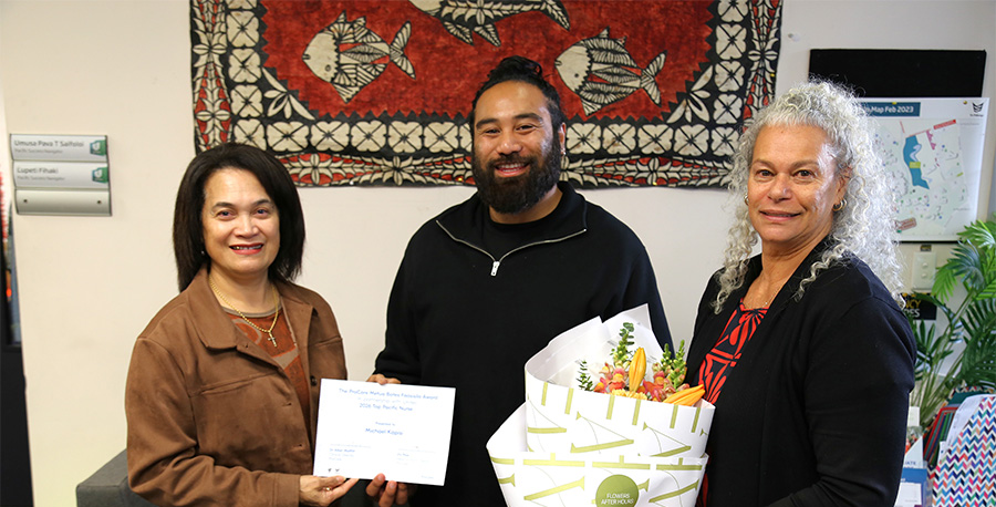 Michael Kapisi and two of his lecturers.