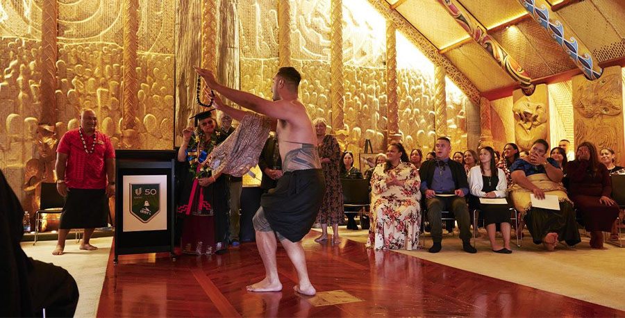 Associate Professor Lefaoali'i Dion Enari performs a traditional Samoan dance in te wharenui o te Noho Kotahitanga Marae.