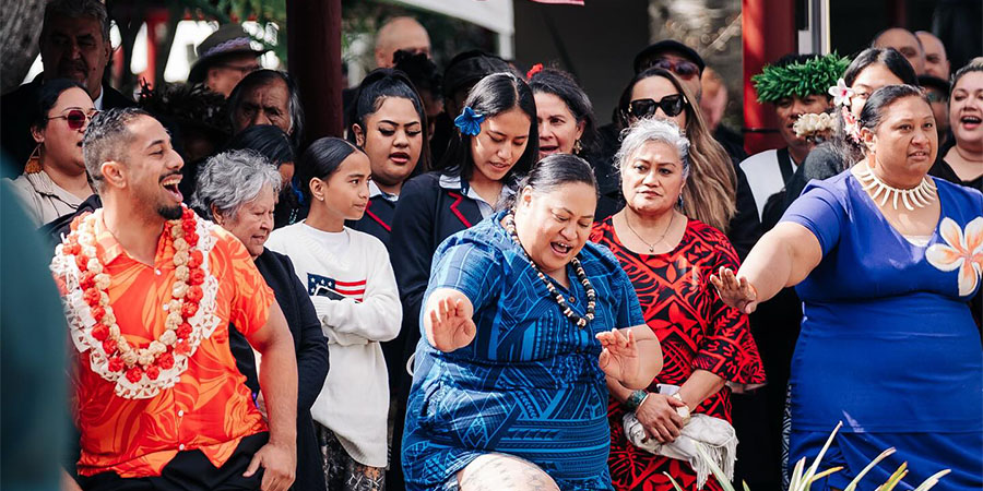A group of people in traditional Samoan attire perform a dance. at the Māori queen's coronation.