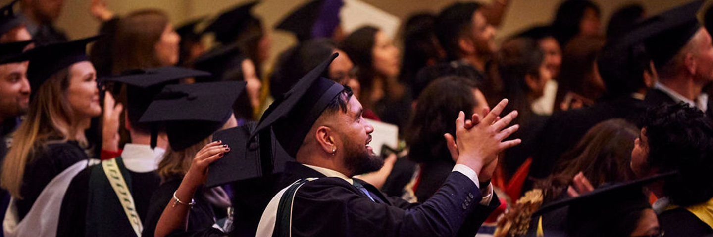 Graduates in the audience applaud during a Unitec graduation ceremony