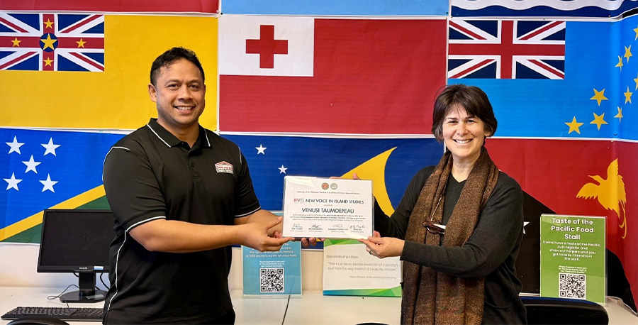 Lecturer – Pacific Academic Development Venusi Taumoepeau (L) shows off his award.