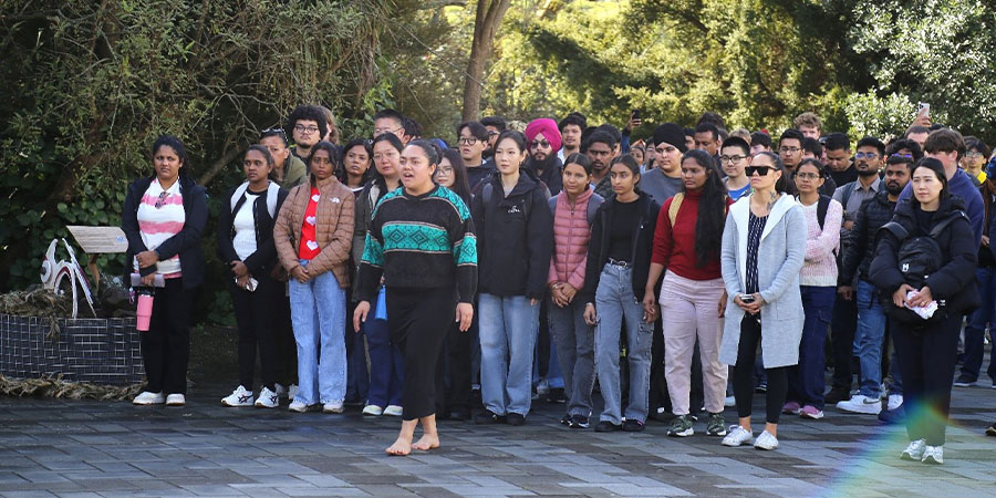 Students walk onto the marae during the welcome pōwhiri.