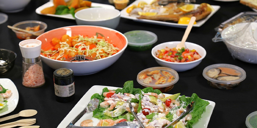 Food laid out on a table for the Vanuatu Bislama Language Week celebration.