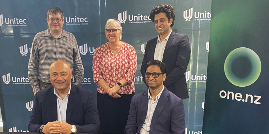 Signatories on the OneNZ partnership smile for the camera.
