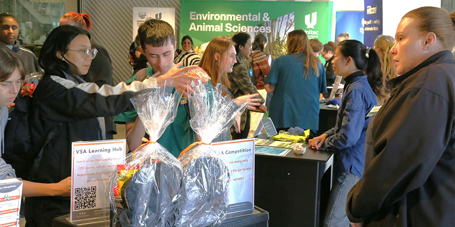Students talk to employers at a stand at the industry connect event. 