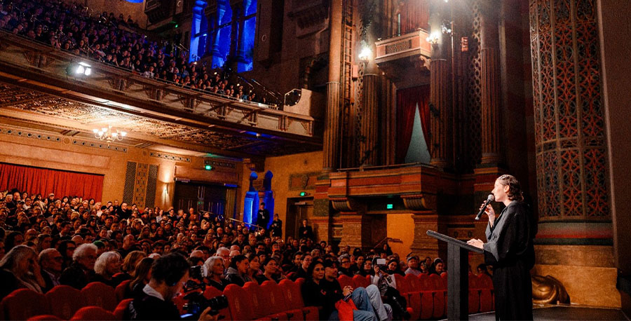 Paloma Schneideman gives a speech at a cinema.