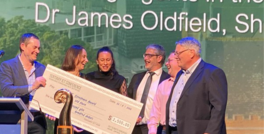 Dr James Oldfield, Rochelle Irving and Sharnelle Aumua receive their award.