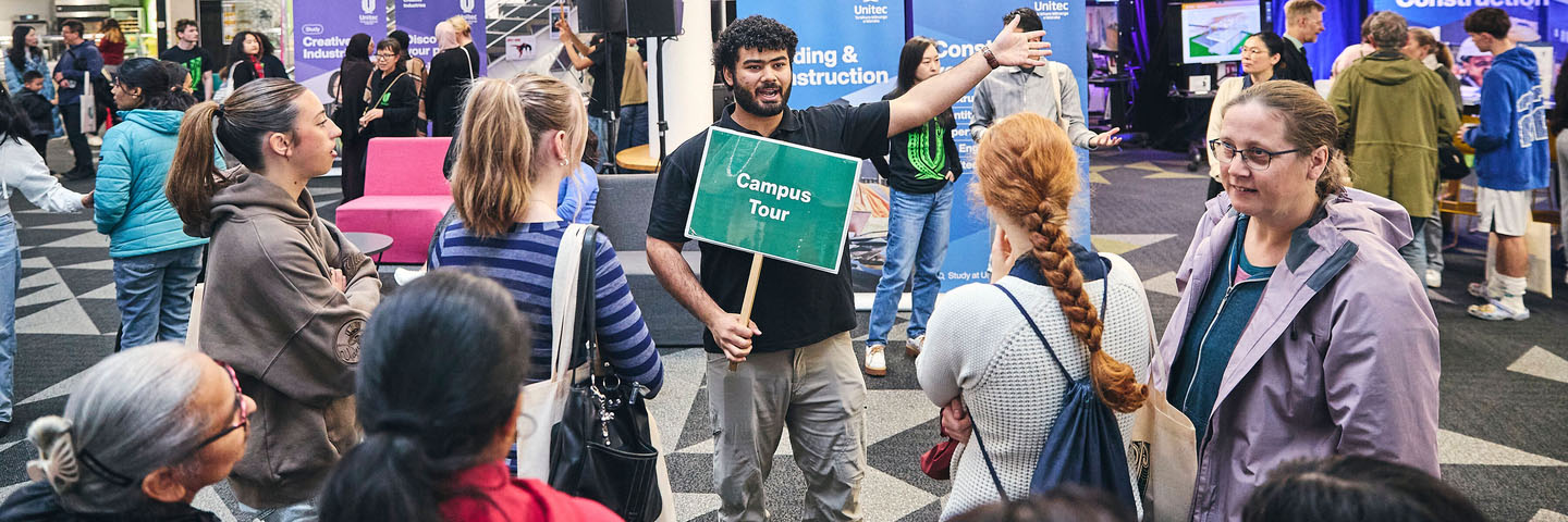 A staff member gives a tour at Open Day.