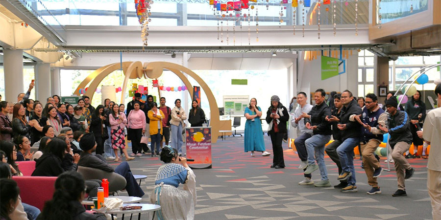 Students take part in a game as part of the Moon Festival.
