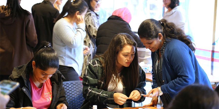 Students at work on zines and bookmarks.