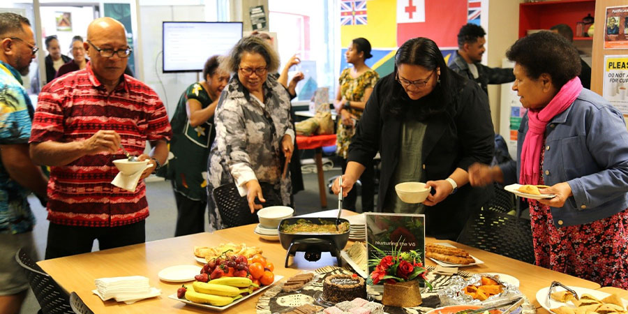 Staff help themselves to food in the Unitec Pacific Centre.