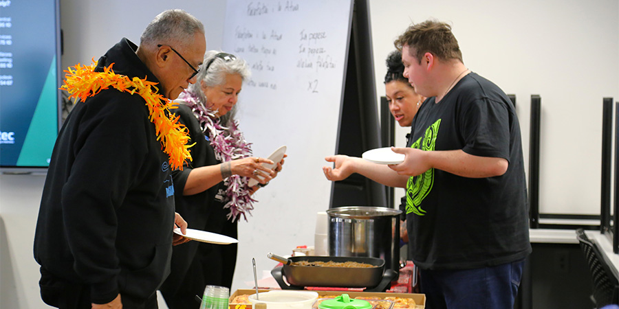 Social Practice students serving kai to our guests from the Polynesian Panthers