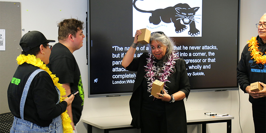 Associate Professor Dr Melani Anae talks to a student.