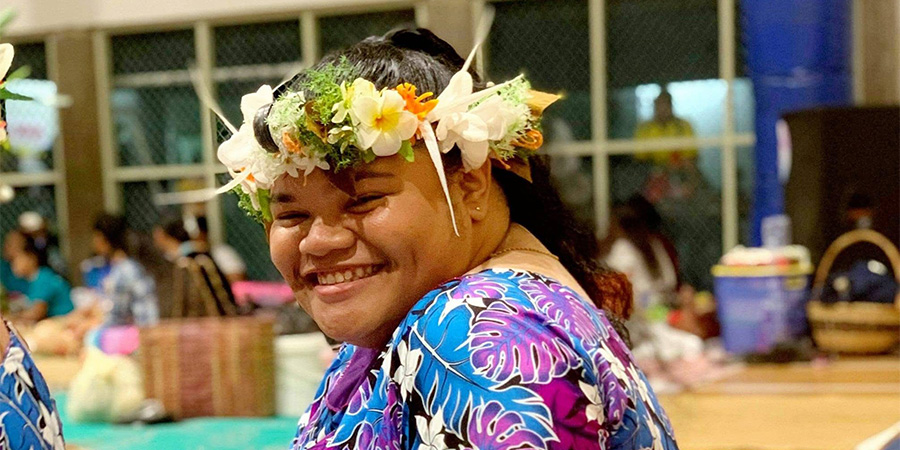 Bachelor of Social Practice student Souzhay Segaawekana Eluti in traditional Tuvaluan attire smiles for the camera.