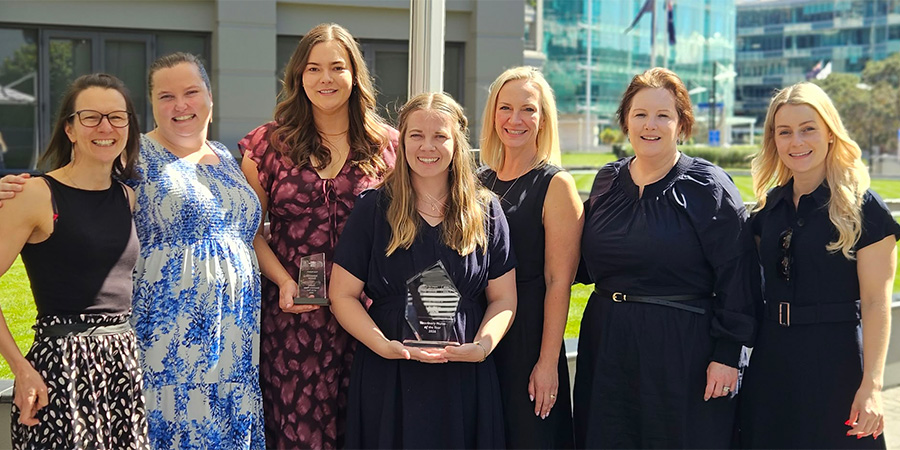 Lauren Prior with the two other finalists for Vet Nurse of the Year and NZVNA Executive Members including current president & Head of School of Environmental and Animal Sciences Associate Professor Laura Harvey smiling for the camera.